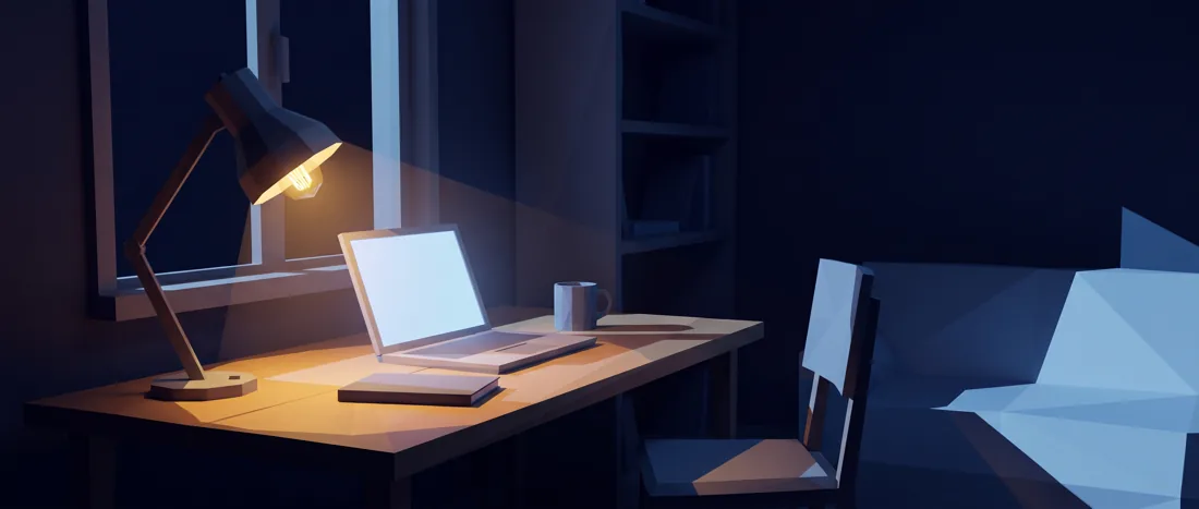 A lamp-lit desk at night with a laptop just opened.